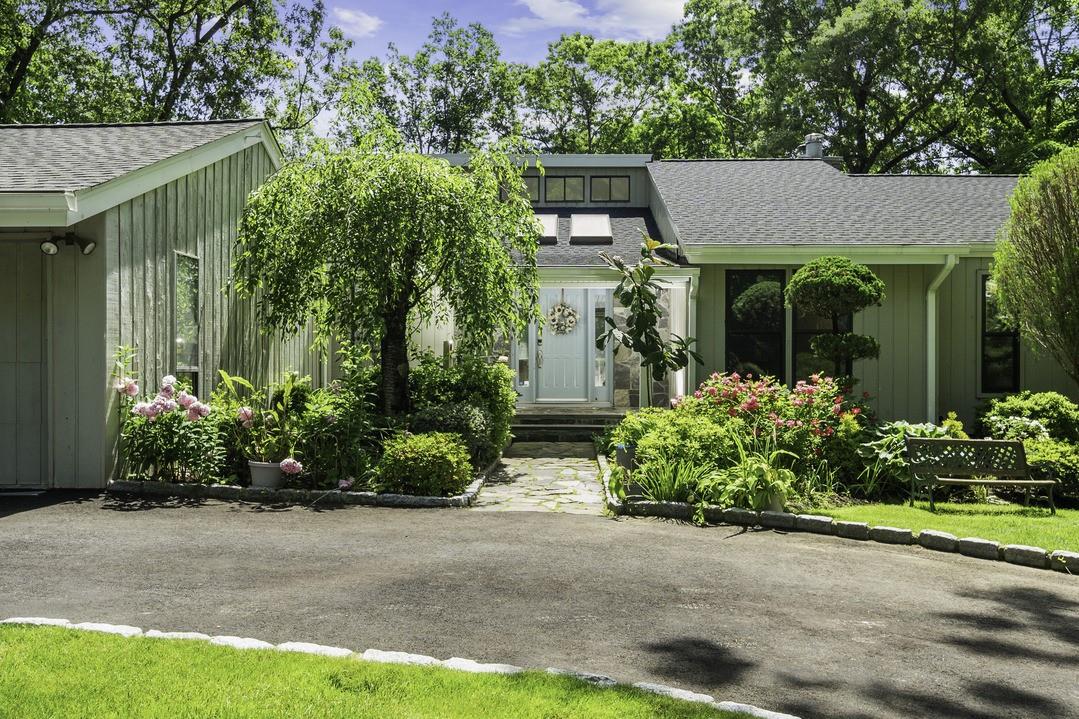 99 Law Road Briarcliff Manor, NY 10510 - Photo 1 of 1 front view of house with potted plants