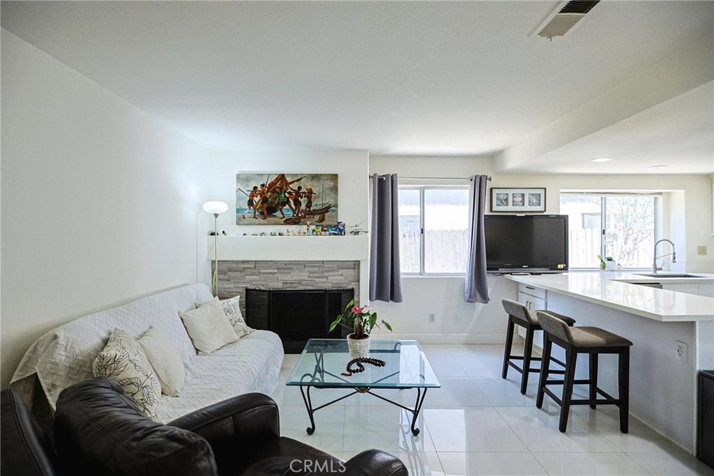 13079 Winterpark Way Riverside, CA 92503 - Photo 16 of 33 a living room with furniture and a fireplace