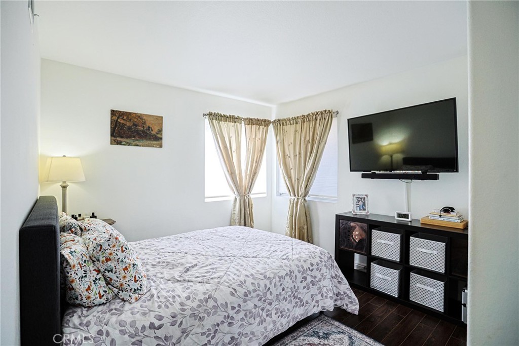 13079 Winterpark Way Riverside, CA 92503 - Photo 19 of 33 a bedroom with a bed and a flat screen tv