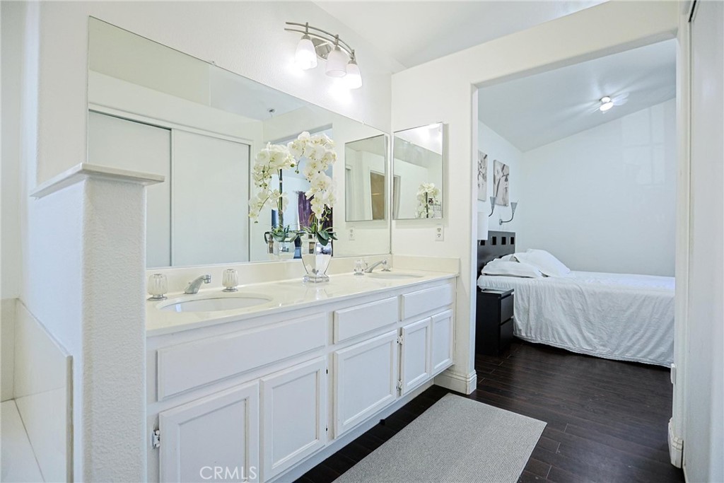 13079 Winterpark Way Riverside, CA 92503 - Photo 26 of 33 a bathroom with a double vanity sink mirror and bathtub