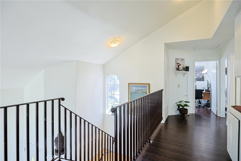 13079 Winterpark Way Riverside, CA 92503 - Photo 27 of 33 a view of a hallway with wooden floor and stairs