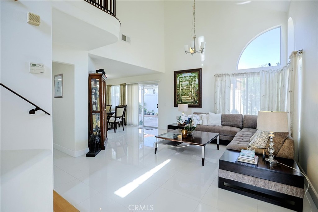 13079 Winterpark Way Riverside, CA 92503 - Photo 3 of 33 a living room with furniture and wooden floor