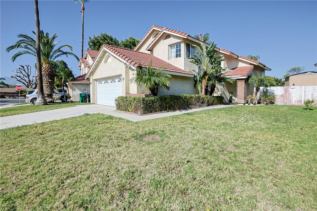 13079 Winterpark Way Riverside, CA 92503 - Photo 32 of 33 a view of a house with a yard and potted plants