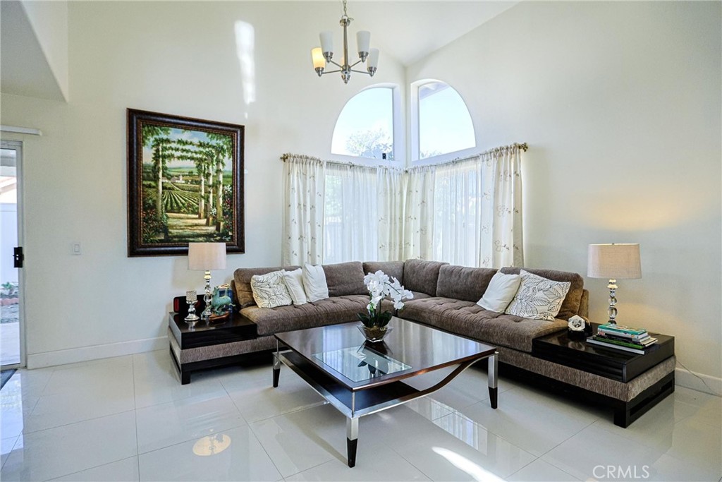 13079 Winterpark Way Riverside, CA 92503 - Photo 5 of 33 a living room with furniture a rug and a window