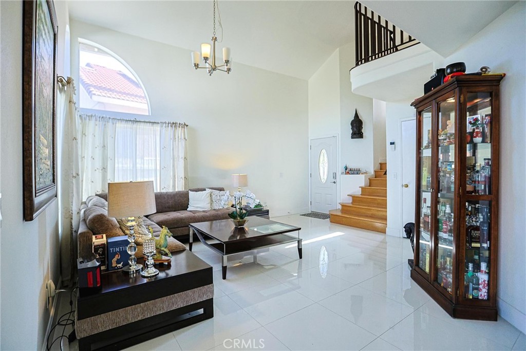 13079 Winterpark Way Riverside, CA 92503 - Photo 6 of 33 a living room with furniture and wooden floor