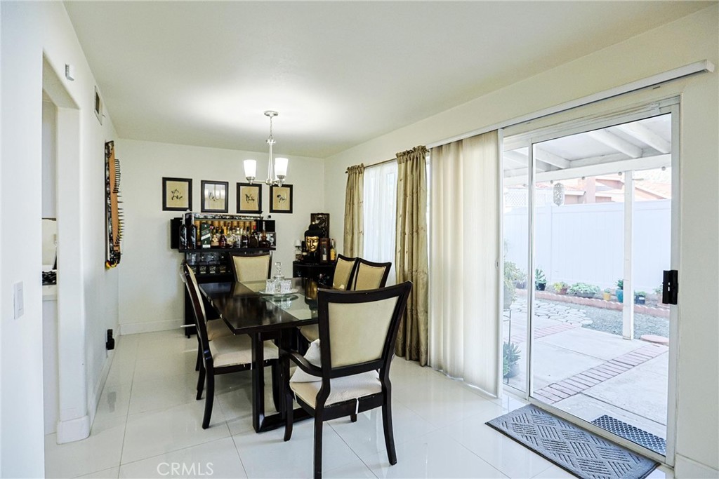 13079 Winterpark Way Riverside, CA 92503 - Photo 8 of 33 a view of a dining room with furniture and a window