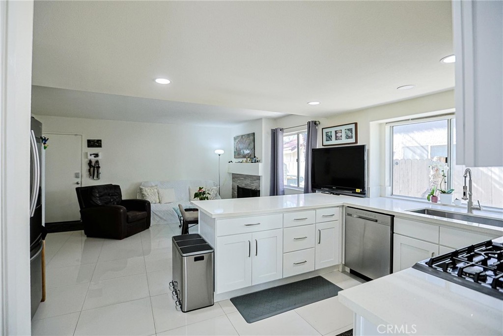 13079 Winterpark Way Riverside, CA 92503 - Photo 10 of 33 a kitchen with a sink and cabinets