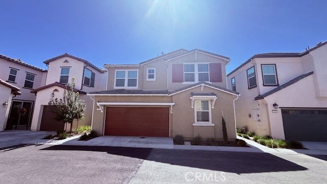 a front view of a house with yard