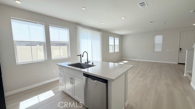 2112 Rio Grande Pomona, CA 91766 - Photo 3 of 10 a kitchen with a sink a window and wooden floor