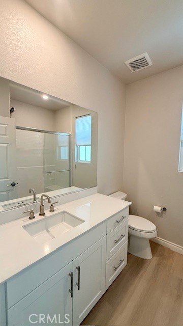 2112 Rio Grande Pomona, CA 91766 - Photo 5 of 10 a bathroom with a sink a toilet and a mirror