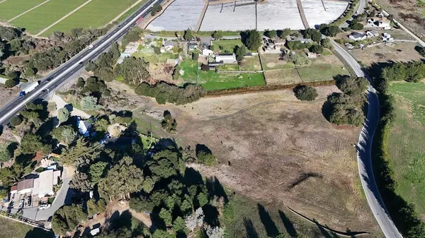 a view of a backyard of the house
