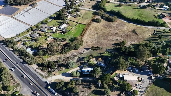 an aerial view of swimming pool yard and green space