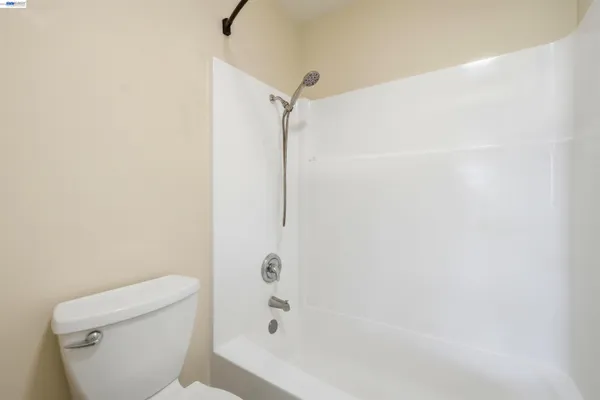 a bathroom with a shower and a toilet