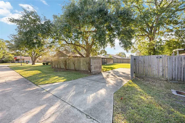 a view of a backyard with swimming pool