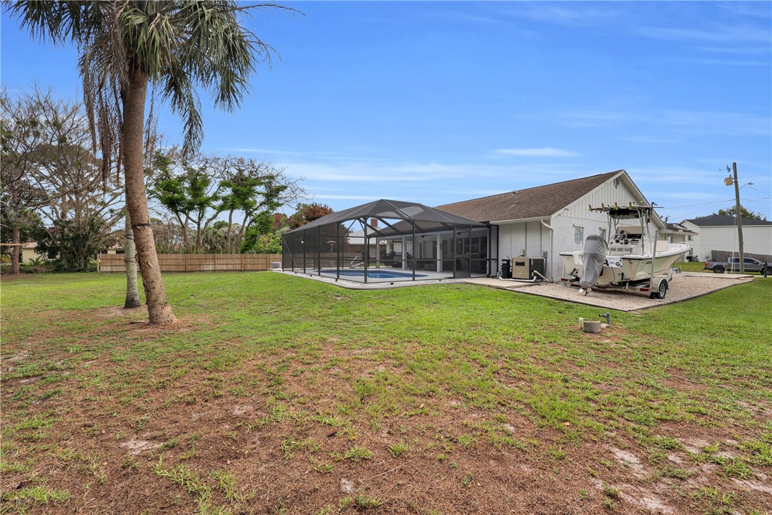 1950 Southwest Logwood Road Port St. Lucie, FL 34953 - Photo 28 of 32 a view of a house with a swimming pool