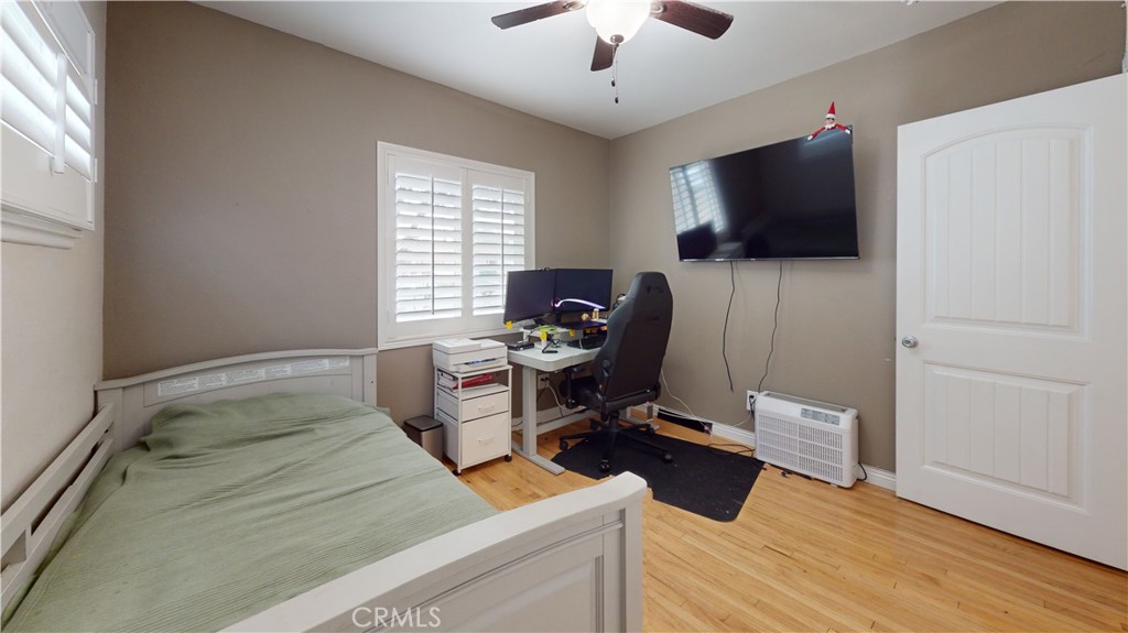 10039 Primrose Drive Riverside, CA 92503 - Photo 28 of 56 a room with furniture and flat screen tv