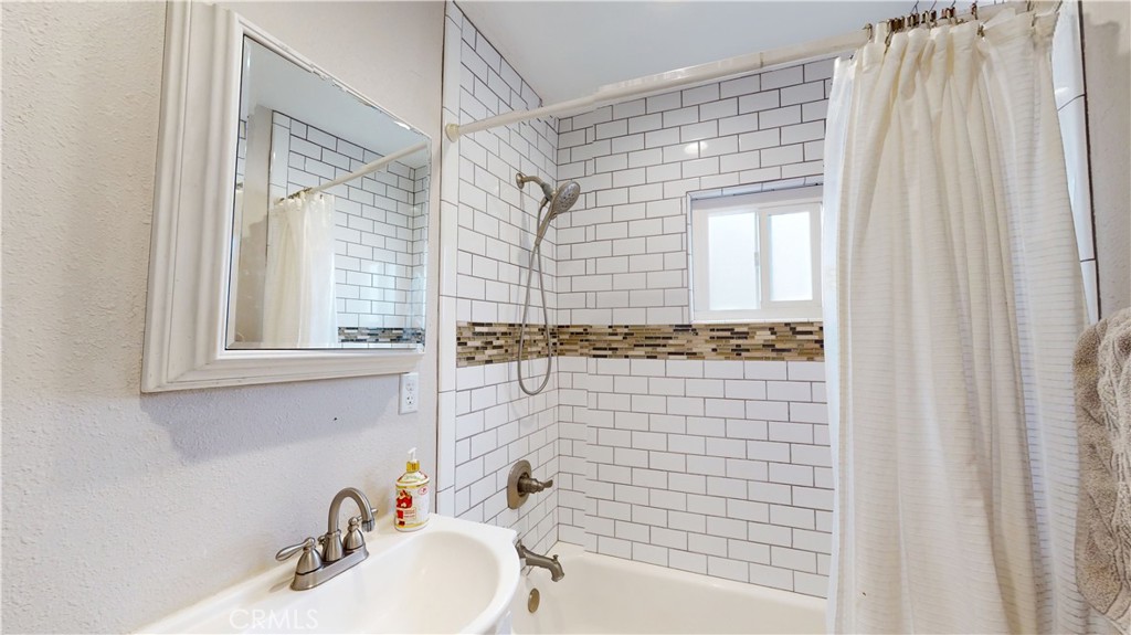 10039 Primrose Drive Riverside, CA 92503 - Photo 29 of 56 a bathroom with a sink and a shower