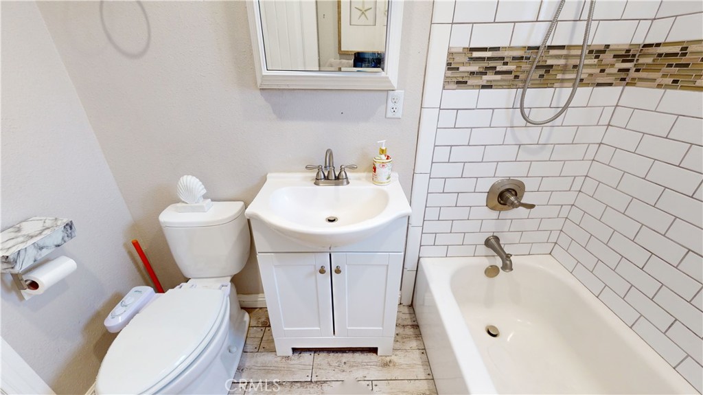 10039 Primrose Drive Riverside, CA 92503 - Photo 30 of 56 a bathroom with a sink and toilet