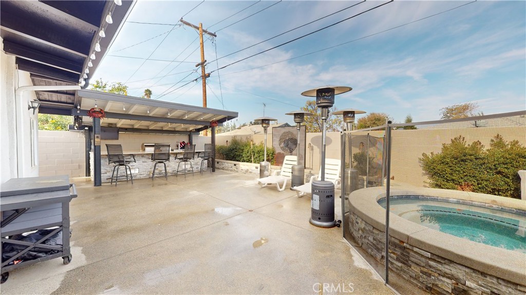 10039 Primrose Drive Riverside, CA 92503 - Photo 41 of 56 a view of a patio with table and chairs