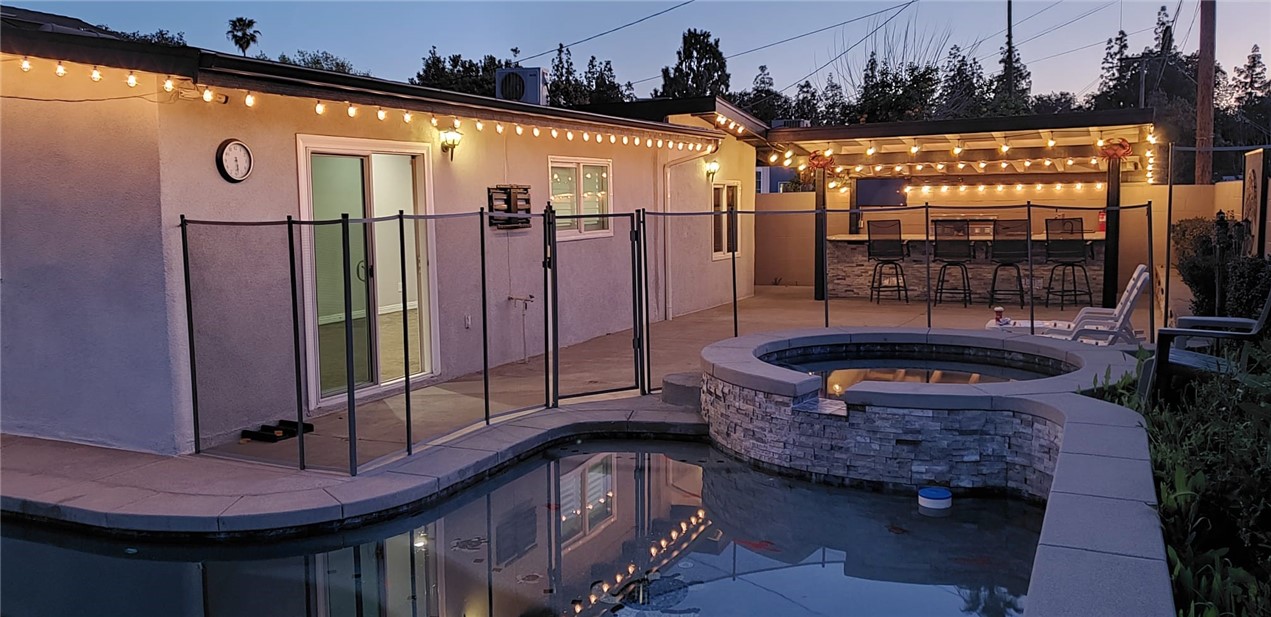 10039 Primrose Drive Riverside, CA 92503 - Photo 44 of 56 a backyard of a house with barbeque oven and outdoor seating