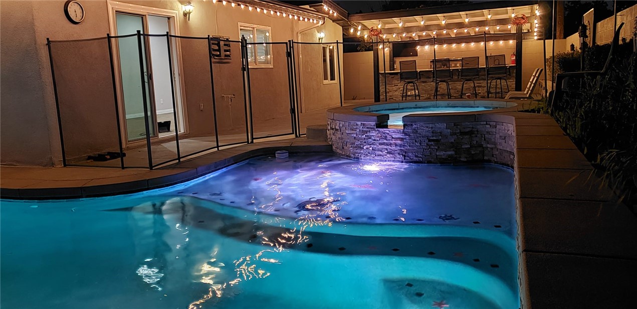 10039 Primrose Drive Riverside, CA 92503 - Photo 50 of 56 a room with water heater and wooden walls