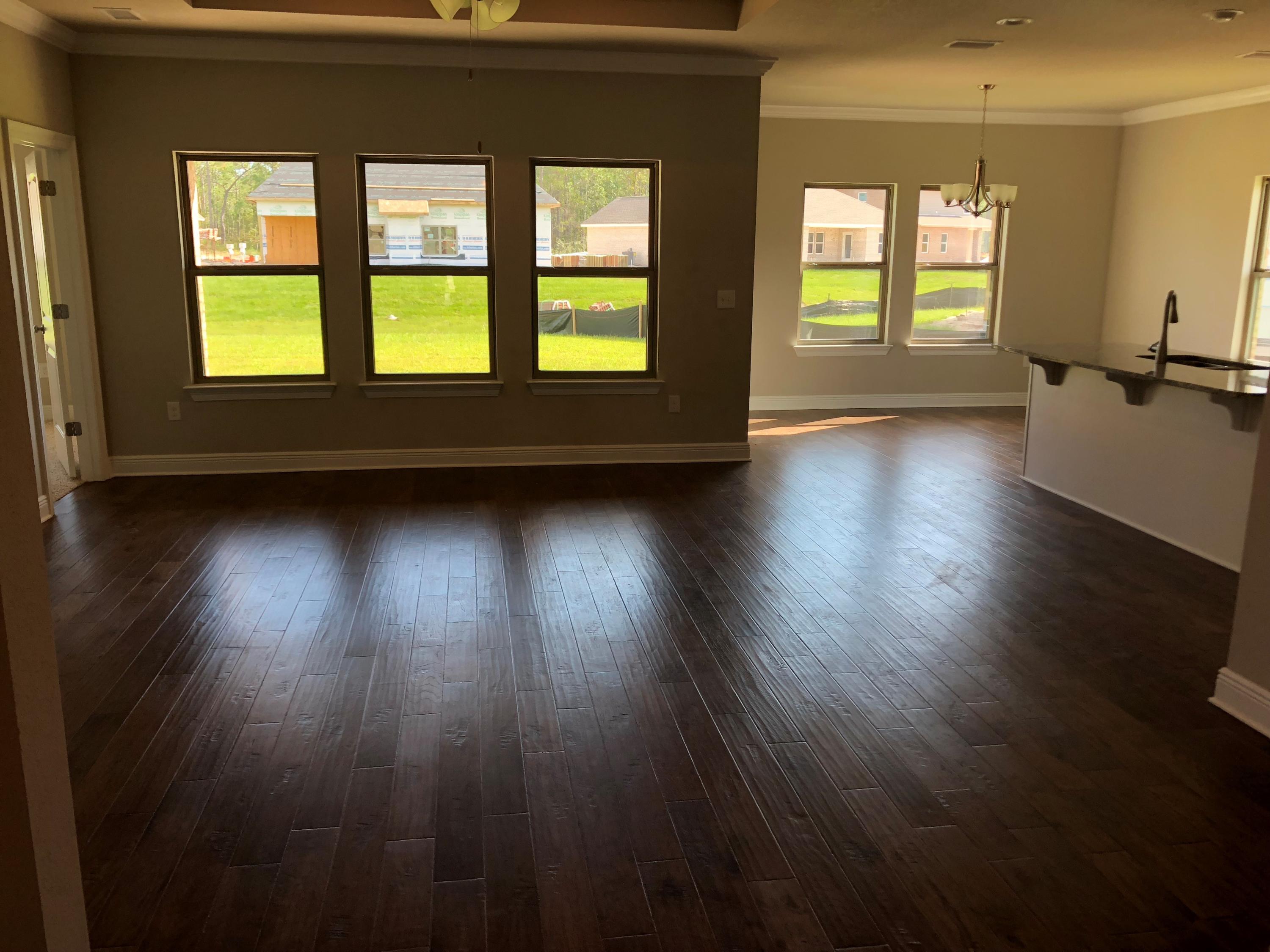 102 Wayne Trail Santa Rosa Beach, FL 32459 - Photo 8 of 31 a view of an empty room with wooden floor and a window