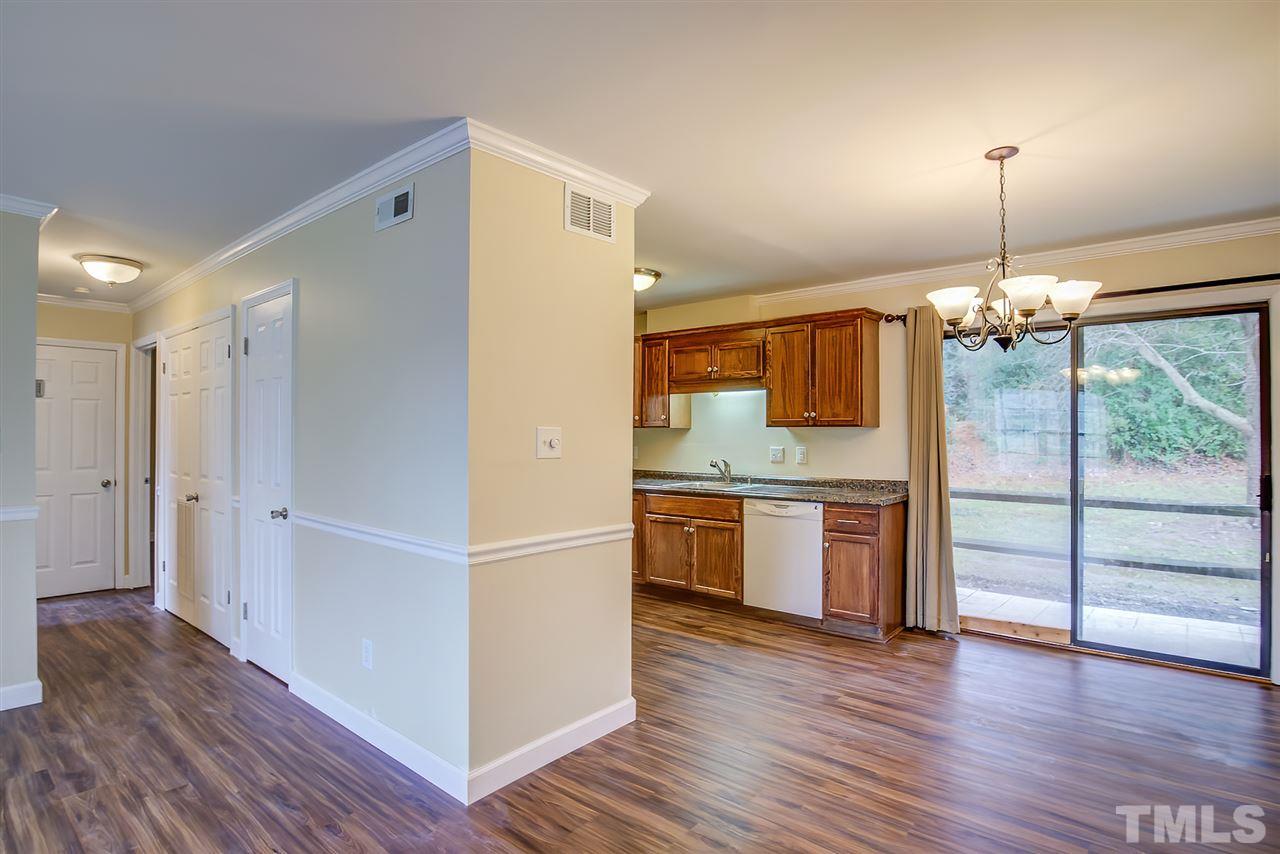 5608 Falls Of Neuse Road, Unit E Raleigh, NC 27609 - Photo 12 of 28 Hallway to Bedrooms/Baths. 1st door on right is coat closet, 2nd set of doors is utility (inc. Washer/Dryer)