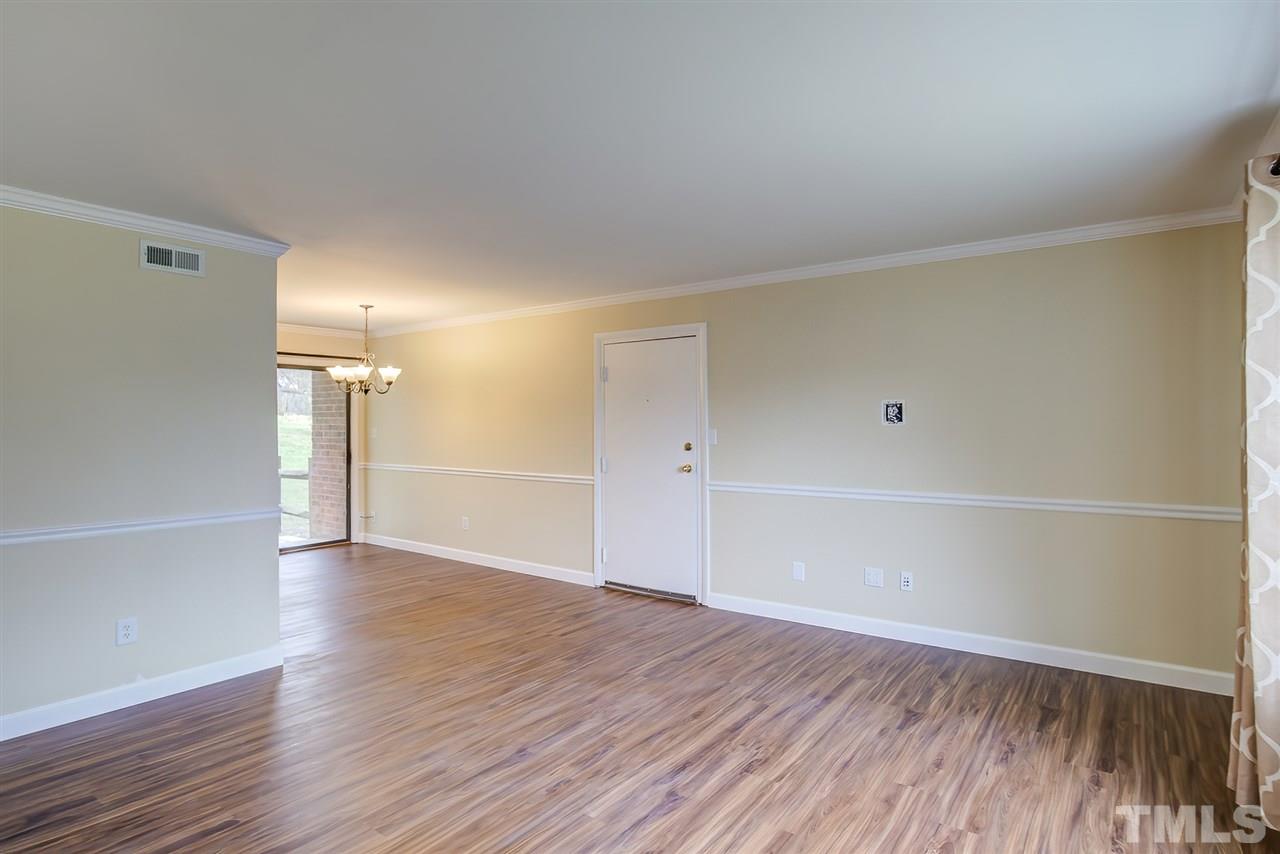 5608 Falls Of Neuse Road, Unit E Raleigh, NC 27609 - Photo 5 of 28 Cut-out to right of door is wired for tv, no hanging, messy wires