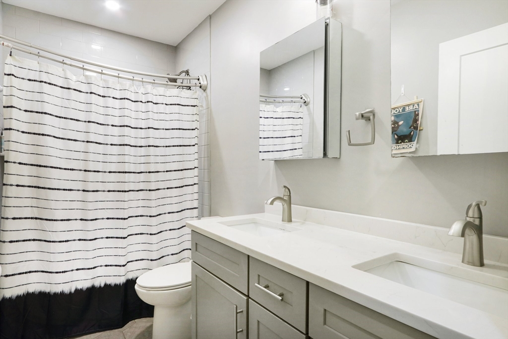 271 West Fifth Street Boston, MA 02127 - Photo 15 of 30 a bathroom with a sink and a toilet