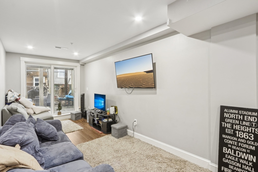 271 West Fifth Street Boston, MA 02127 - Photo 7 of 30 a living room with furniture and a flat screen tv