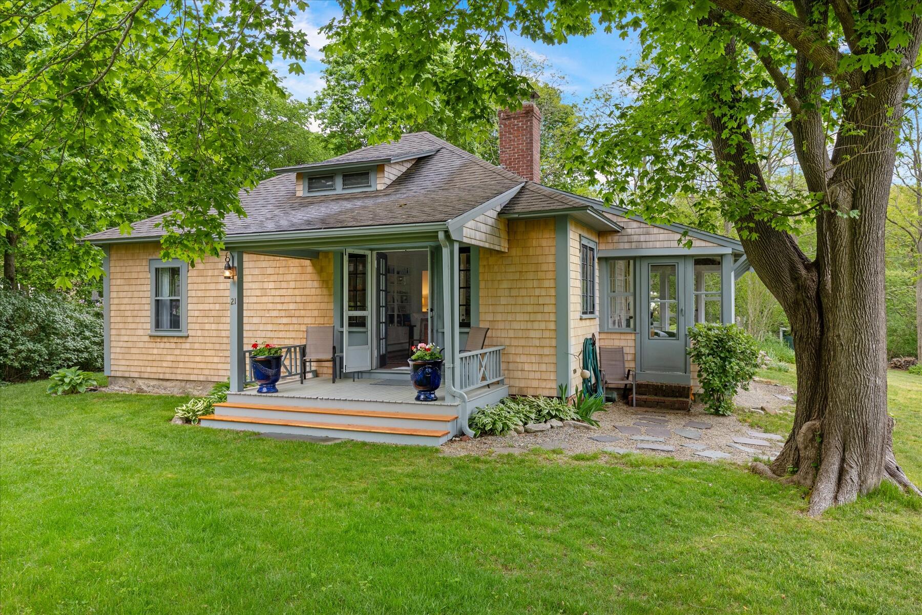 21 Quaker Road East Sandwich, MA 02537 - Photo 6 of 43 a front view of house with a garden and patio