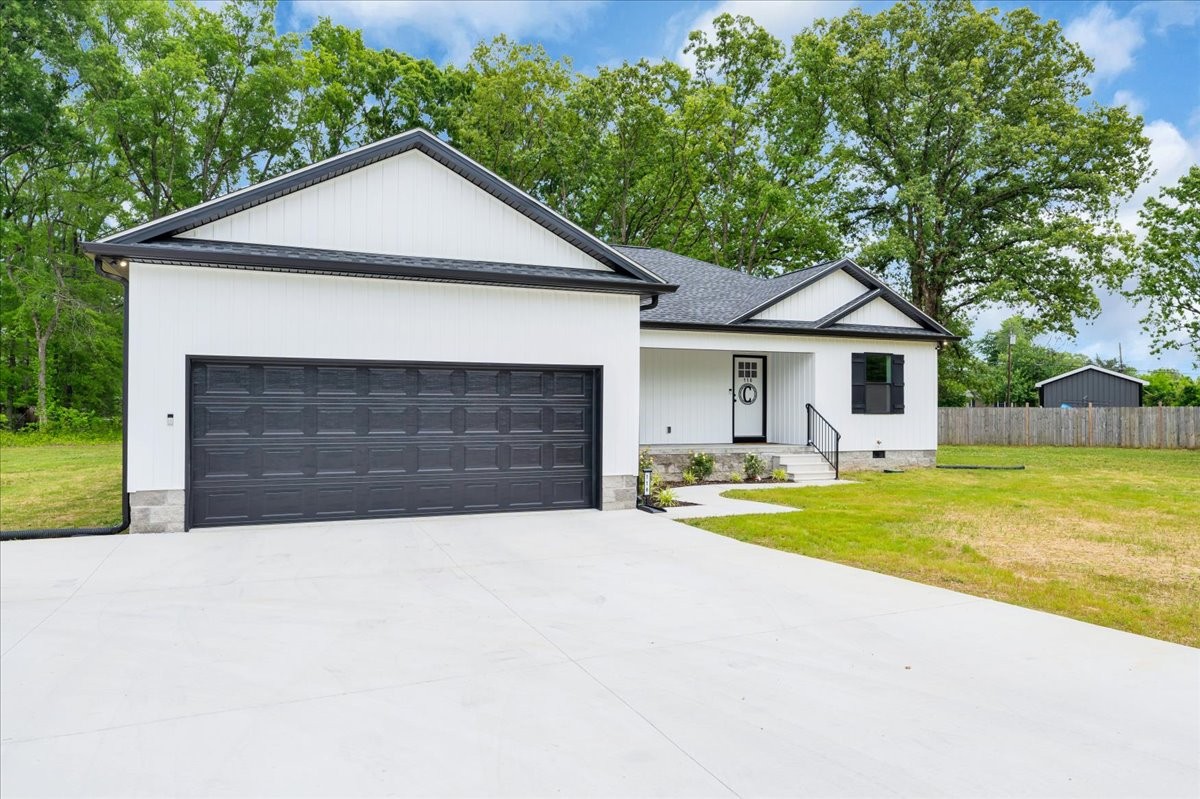 116 Carter Blake Road Tullahoma, TN 37388 - Photo 3 of 43 a front view of a house with yard and trees