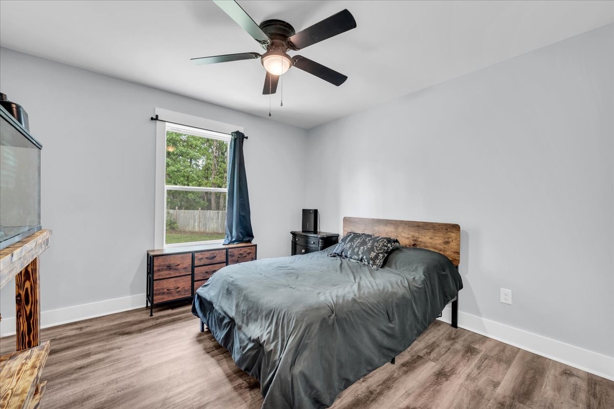 116 Carter Blake Road Tullahoma, TN 37388 - Photo 32 of 43 a bedroom with a bed and a flat tv screen on dresser