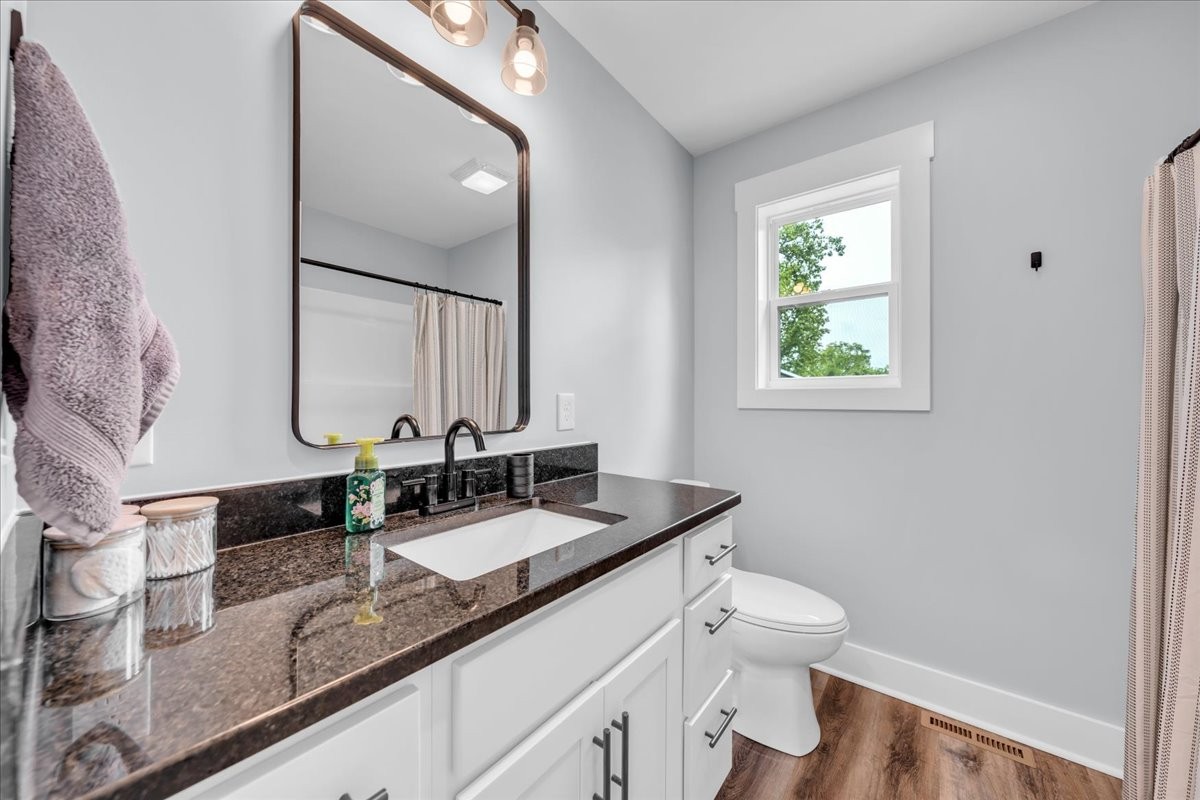 116 Carter Blake Road Tullahoma, TN 37388 - Photo 34 of 43 a bathroom with a granite countertop sink and a mirror