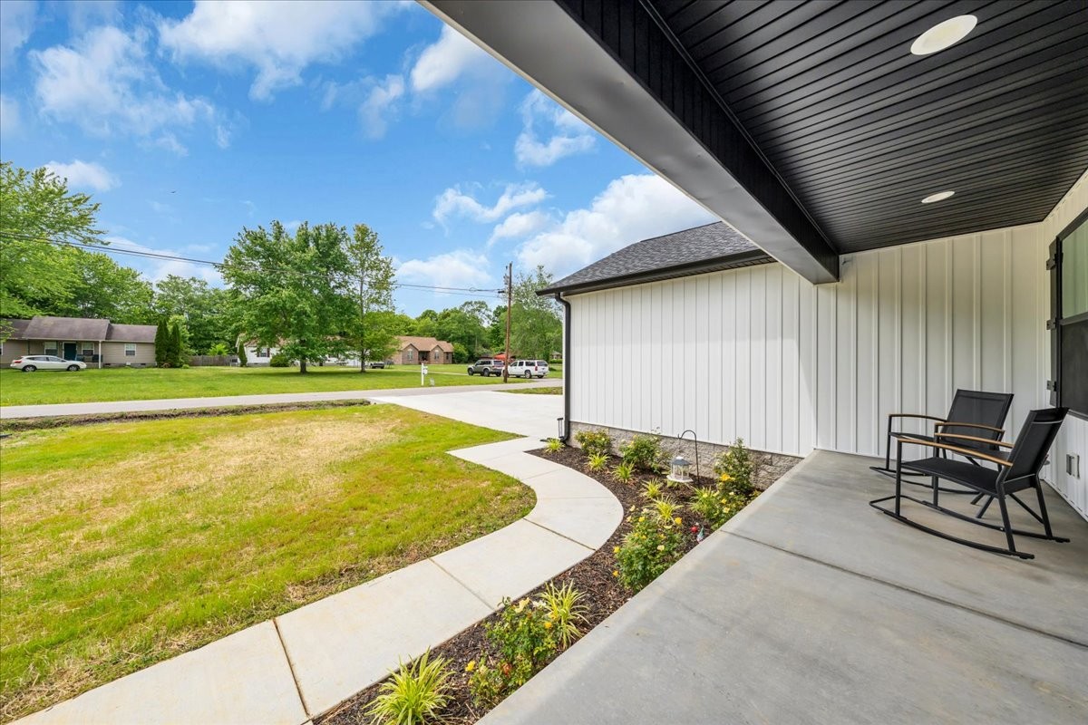 116 Carter Blake Road Tullahoma, TN 37388 - Photo 6 of 43 a swimming pool with outdoor seating and yard