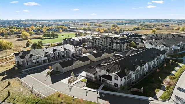 an aerial view of a city with ocean view
