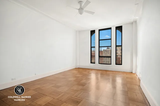 a view of a livingroom with an empty space and window