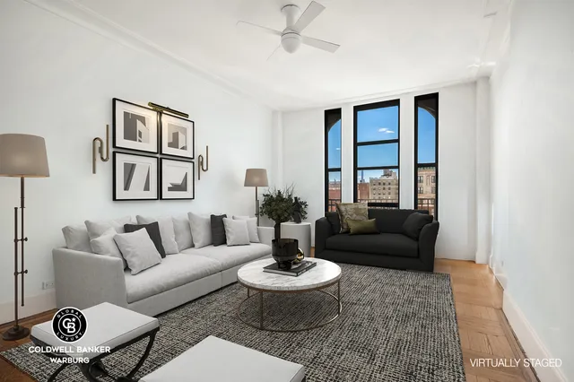 a living room with furniture and a rug