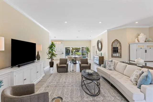 a bedroom with furniture and a flat screen tv