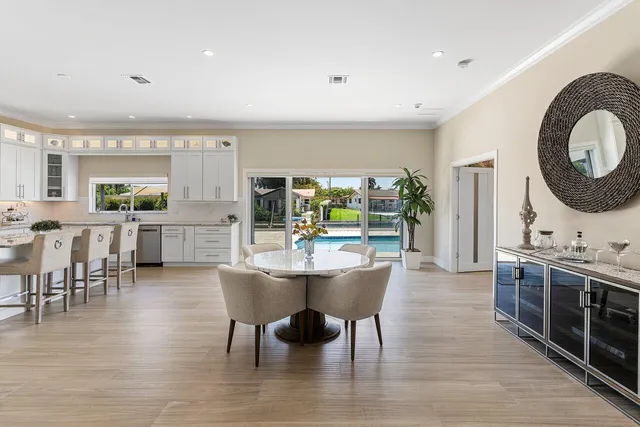 a bathroom with a double vanity sink a toilet and a mirror