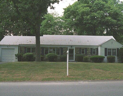 153 Turner Road Stamford, CT 06905 - Photo 1 of 1 a front view of a house with a yard