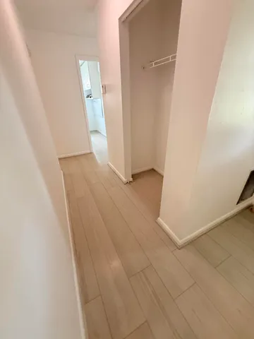 an empty room with a wooden door