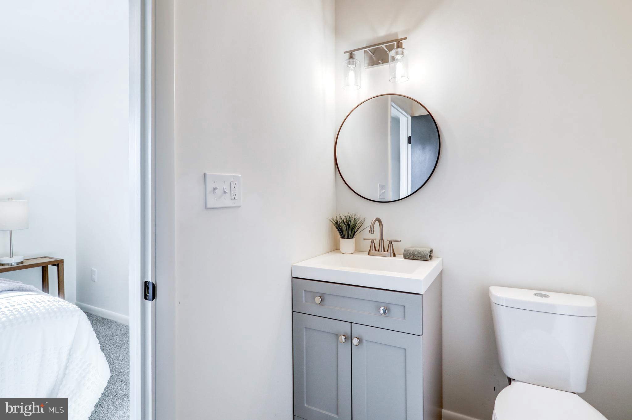 1198 Iron Bridge Road Columbia, PA 17512 - Photo 21 of 40 a bathroom with a toilet sink and mirror