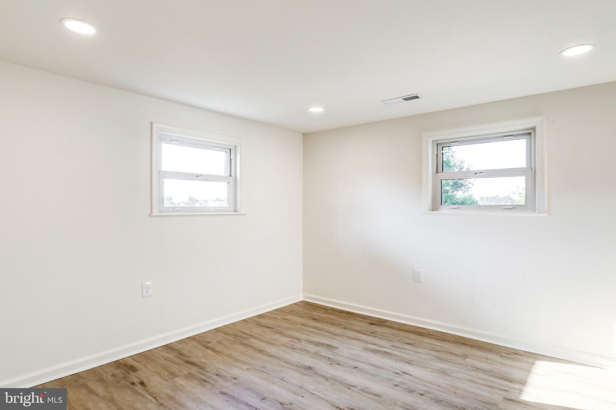 1198 Iron Bridge Road Columbia, PA 17512 - Photo 29 of 40 an empty room with wooden floor and windows