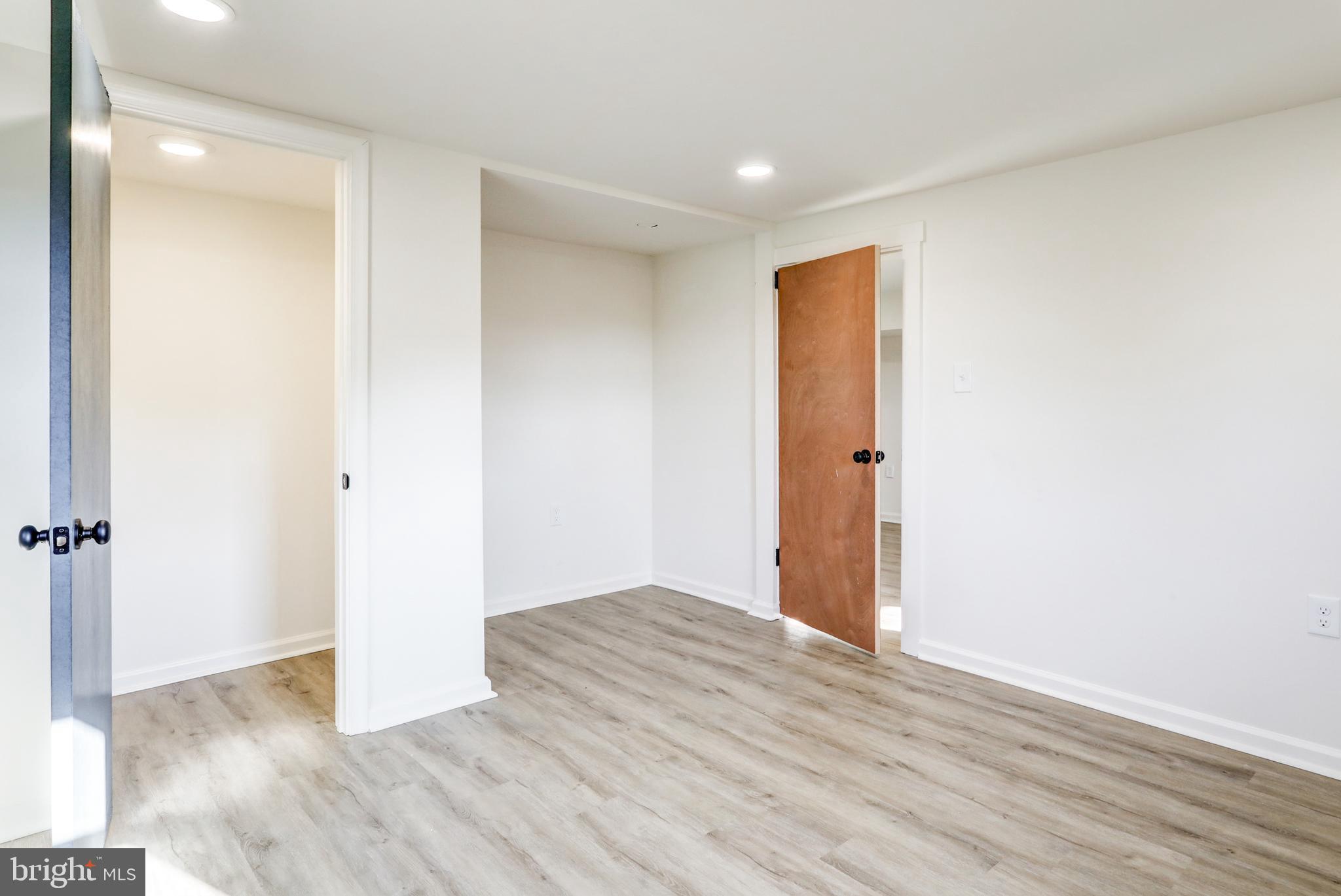 1198 Iron Bridge Road Columbia, PA 17512 - Photo 30 of 40 an empty room with wooden floor and a window