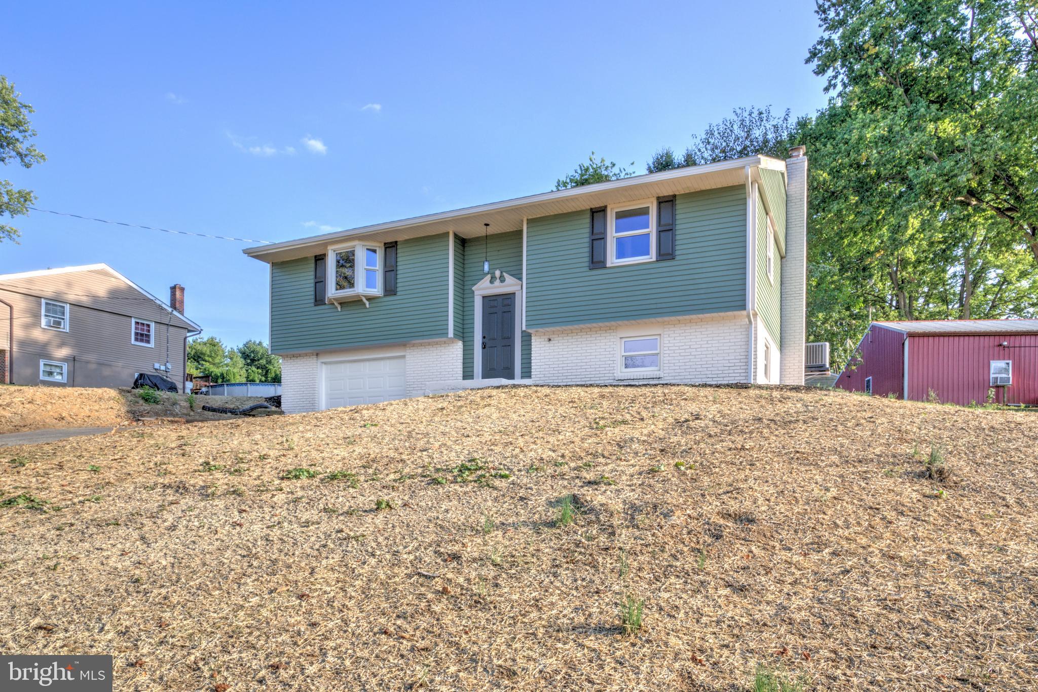 1198 Iron Bridge Road Columbia, PA 17512 - Photo 35 of 40 a front view of a house with a yard