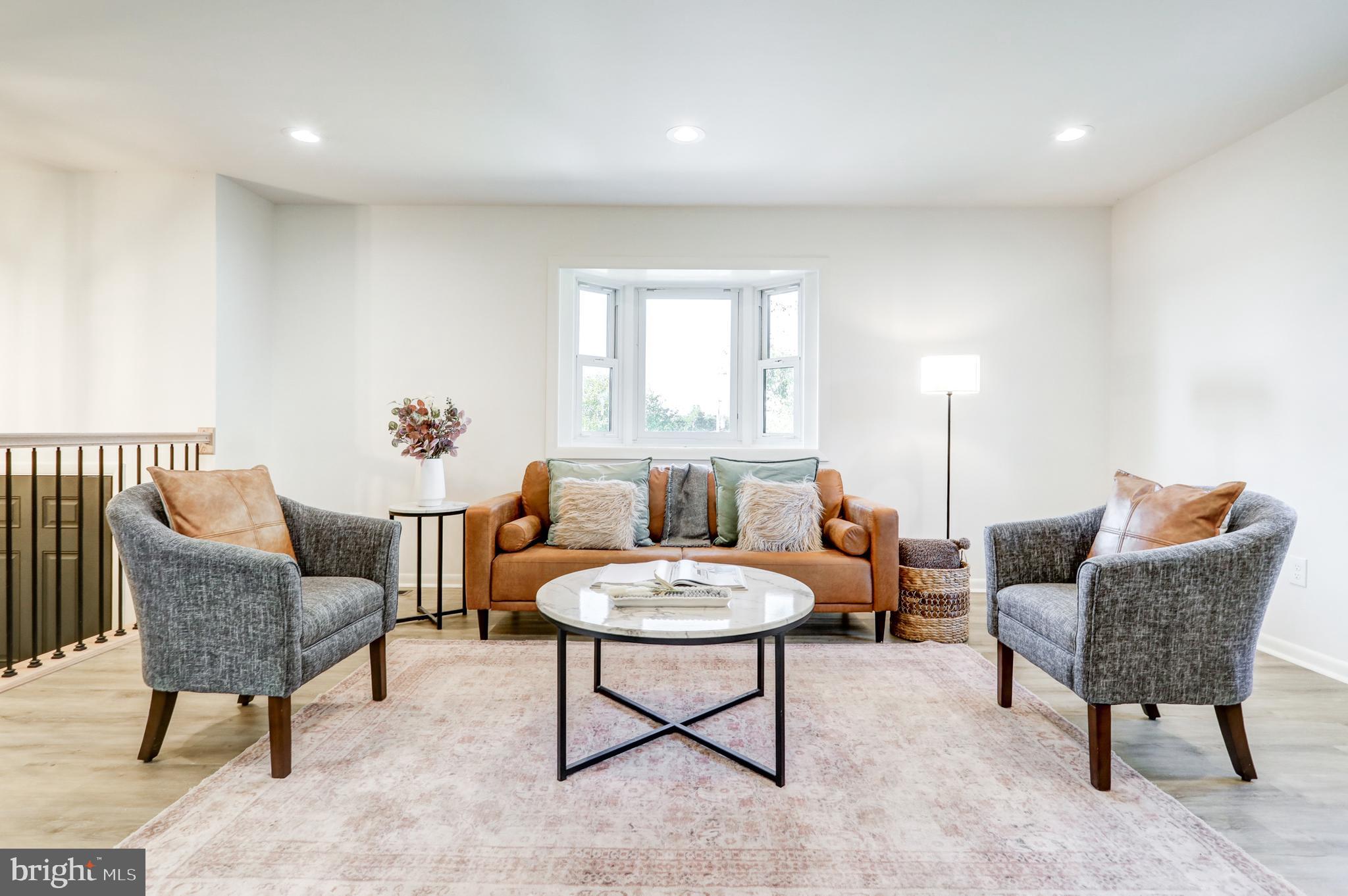 1198 Iron Bridge Road Columbia, PA 17512 - Photo 5 of 40 a living room with furniture and a potted plant