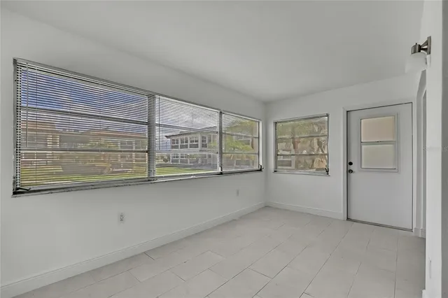 an empty room with windows