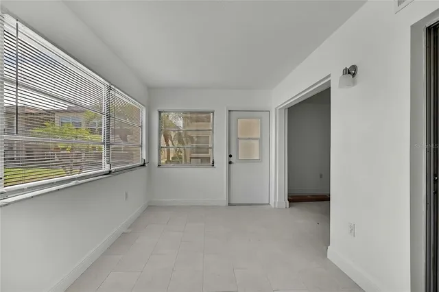 a view of an empty room with a window