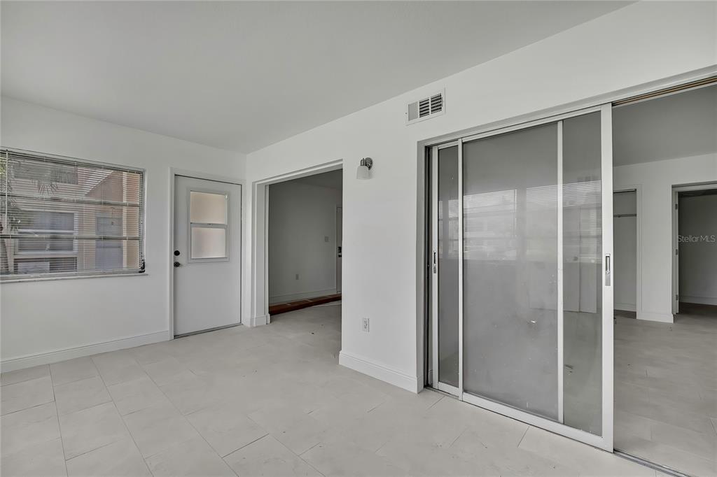 5242 Opal Lane, Unit 106 New Port Richey, FL 34652 - Photo 15 of 22 an empty room with windows